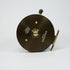 Brown fishing reel with gold accents on a white background