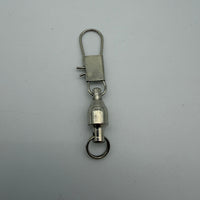 Metal fishing swivel on a gray background
