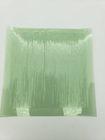 Green fringe curtain on a white background